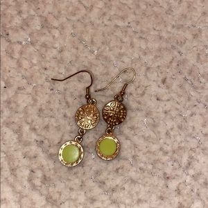 Gold dangle earrings with green accent
